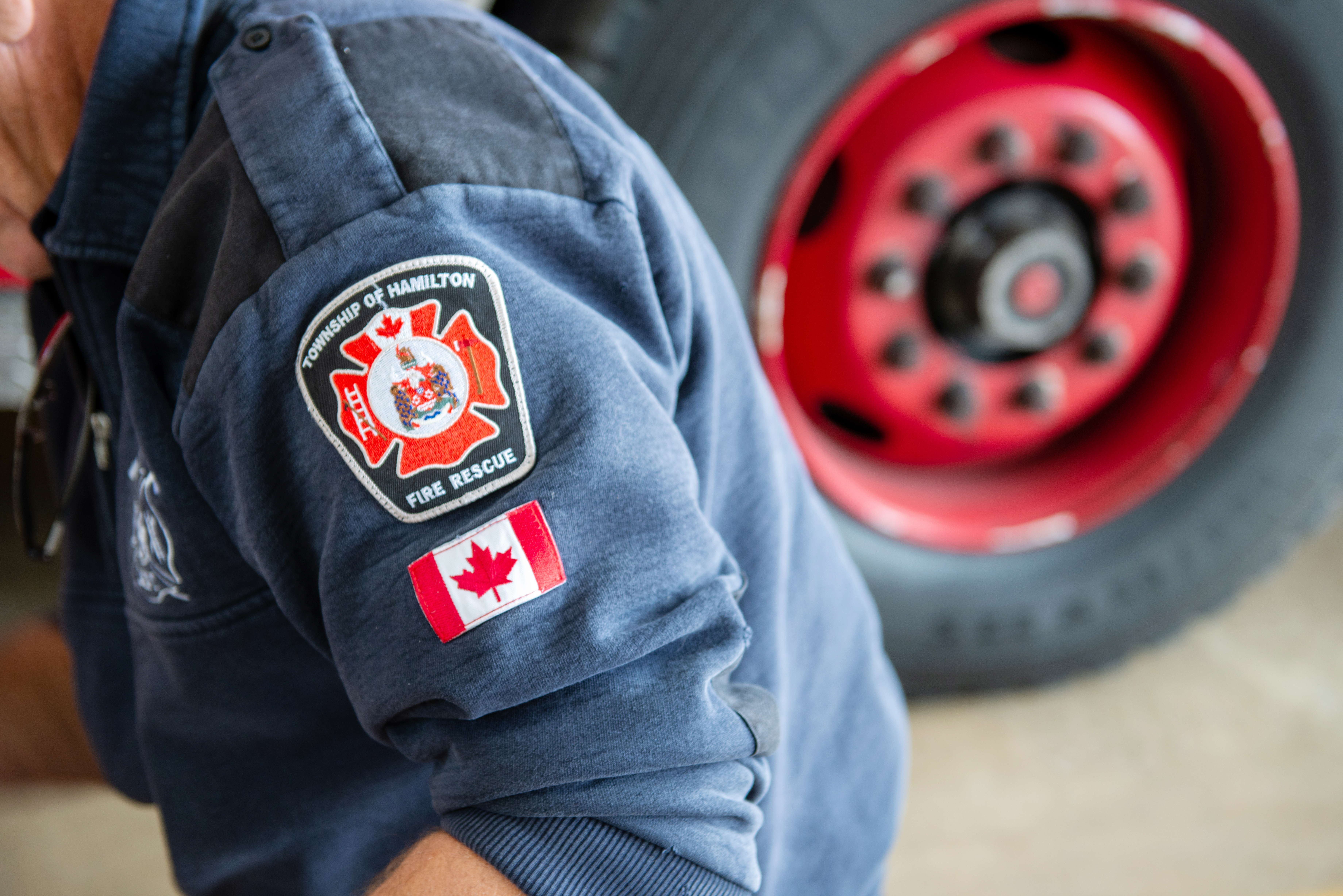 Person working with focus on their fire department badges