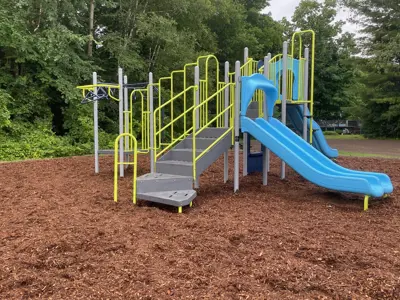 Laurel Park focused on a climbing structure with a slide