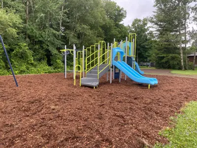 Laurel Park focused on a climbing structure with a slide