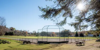 Baltimore Arena baseball diamond surrounded by picnic tables and bleachers