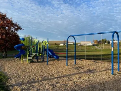 Cold Springs Park focused on a climbing structure and swing set