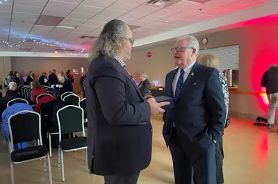 two community members socializing at the Community Recognition Awards event