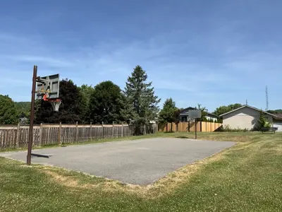 Old Camborne Schoolhouse Playground focused on a basketball court