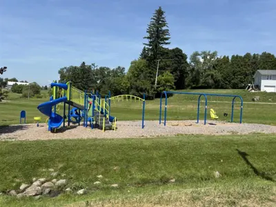 Cold Springs Park focused on a large climbing structure and swingset