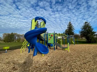 Cold Springs Park focused on a large spiral slide