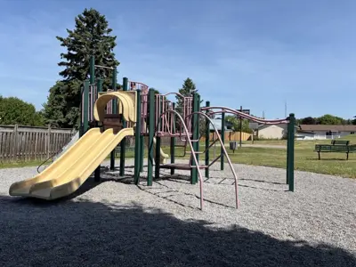 Old Camborne Schoolhouse Playground focused on a climbing structure with slides